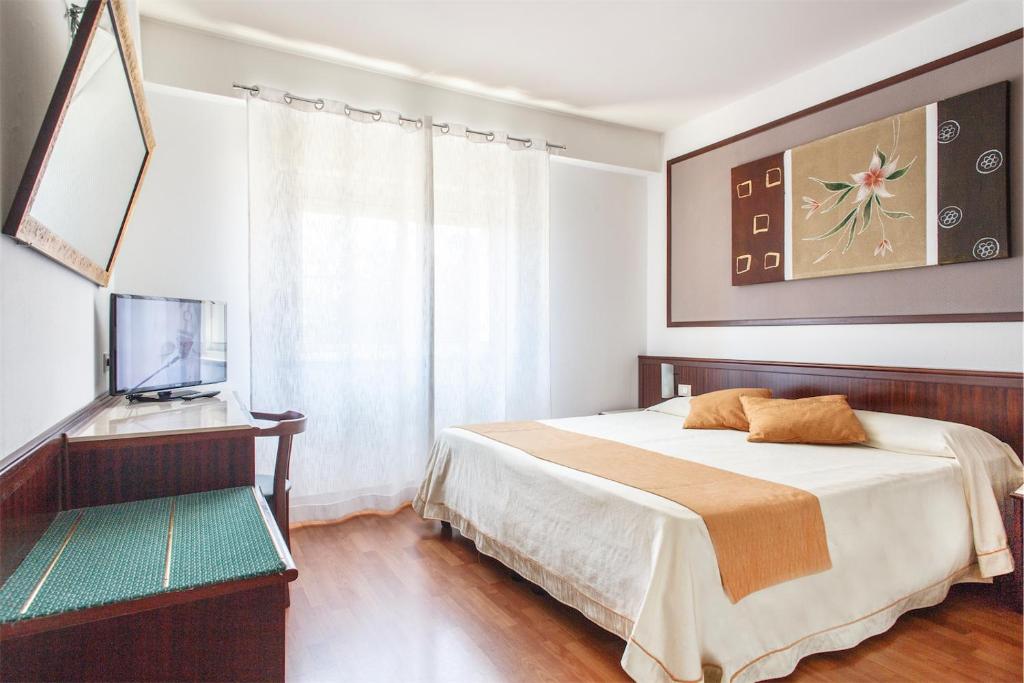 Posteľ alebo postele v izbe v ubytovaní Colleverde Park Hotel