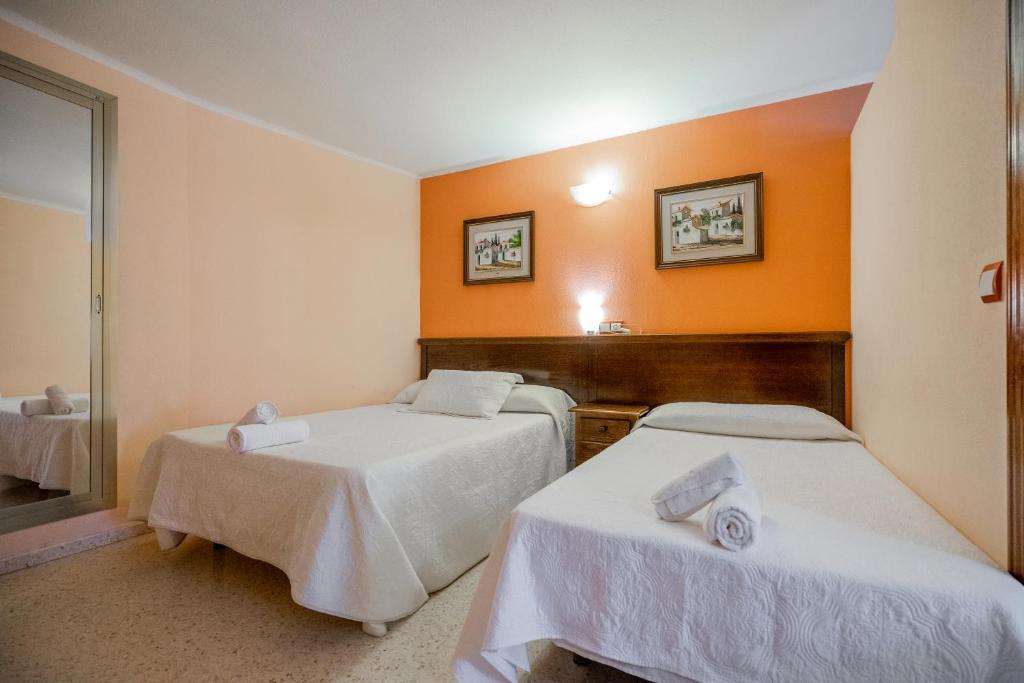 Postel nebo postele na pokoji v ubytování Hotel Velis