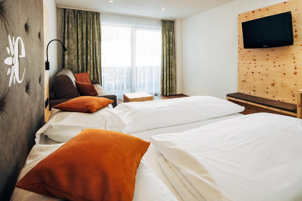 Posteľ alebo postele v izbe v ubytovaní Hotel Edelweiss Superior