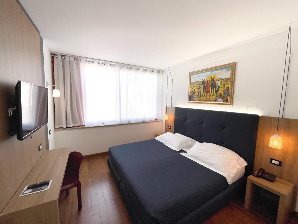 Posteľ alebo postele v izbe v ubytovaní Colleverde Park Hotel