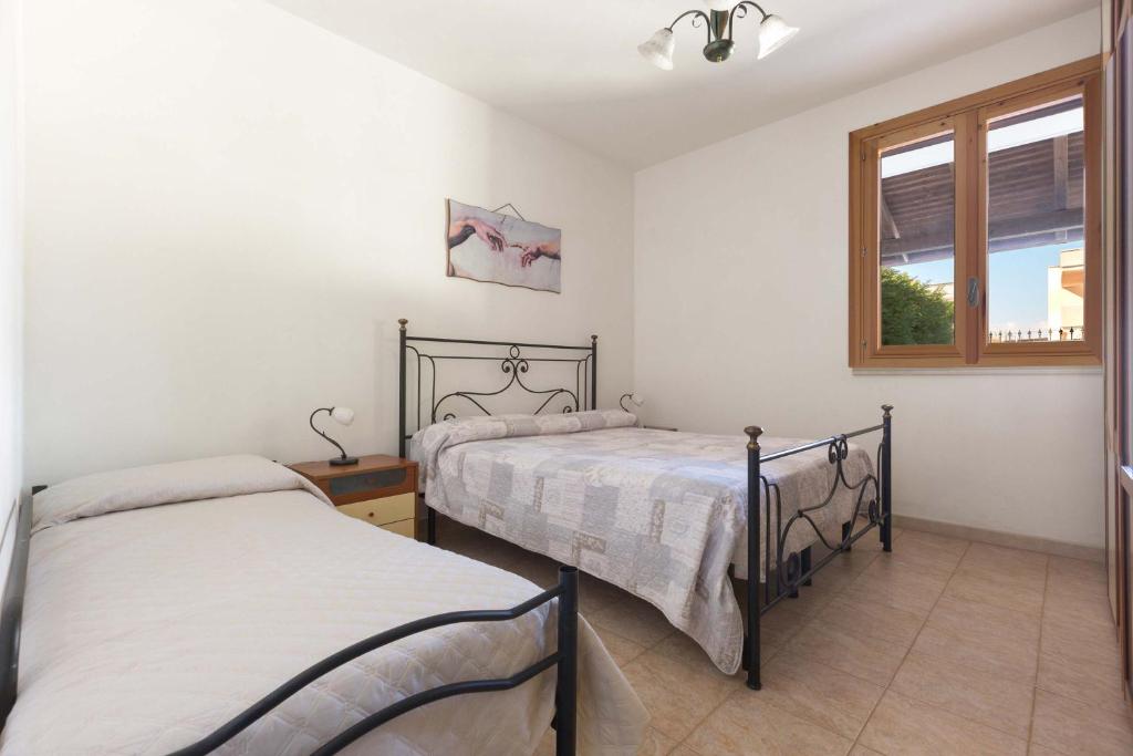A bed or beds in a room at Villino Amos by BarbarHouse