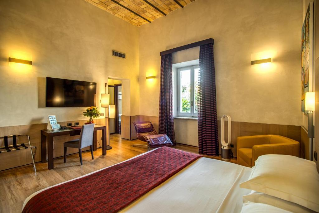 Postel nebo postele na pokoji v ubytování Kolbe Hotel Rome