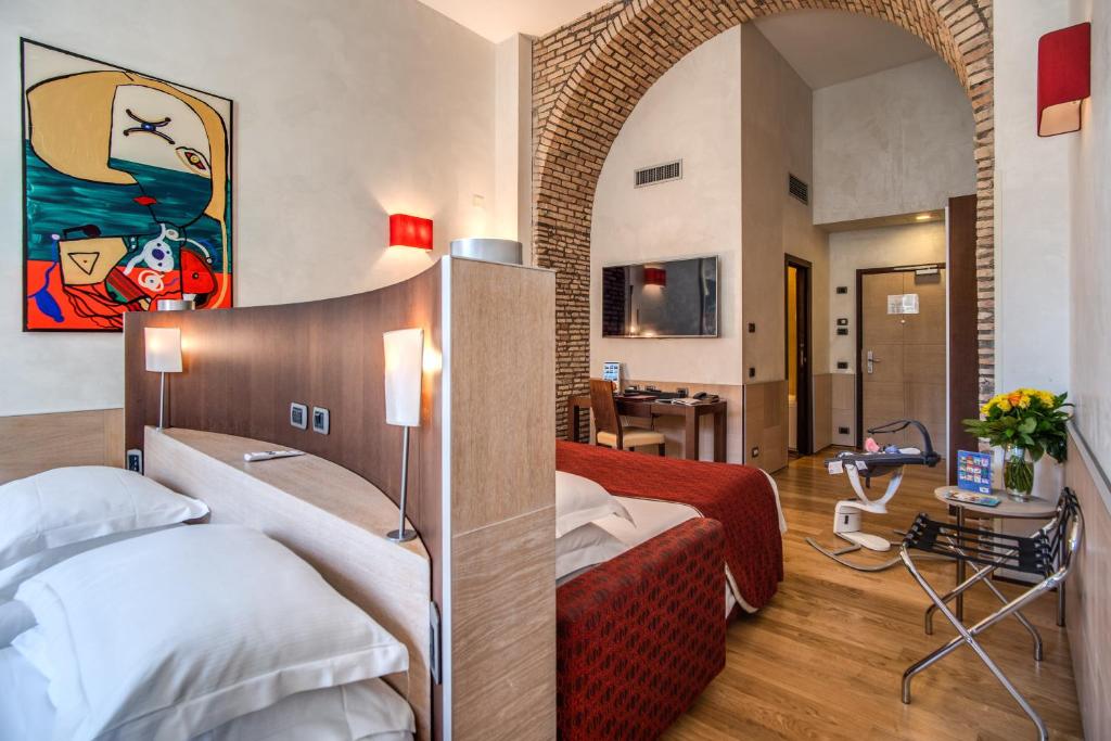 Postel nebo postele na pokoji v ubytování Kolbe Hotel Rome