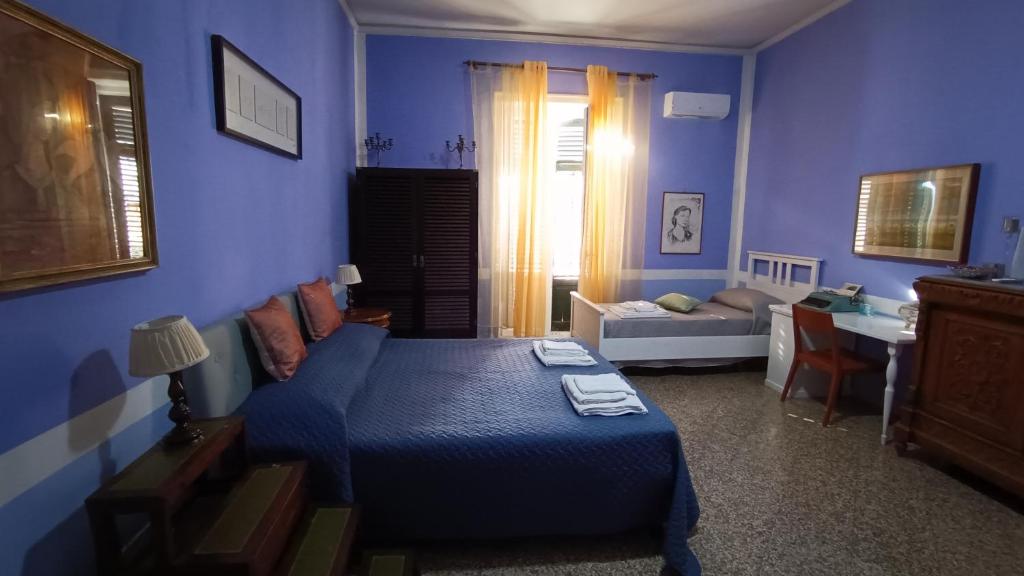 Postel nebo postele na pokoji v ubytování Il Genio del Porto - Mabbonath b&b