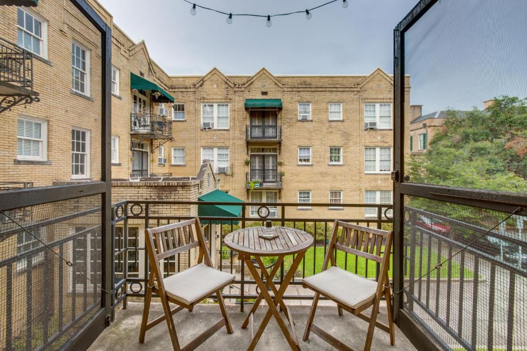 a patio with a table and chairs on a balcony at Walkable Savannah Escape in Historic District! in Savannah