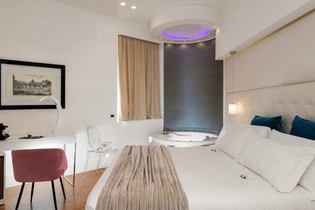 A bed or beds in a room at Argentina Residenza Style Hotel