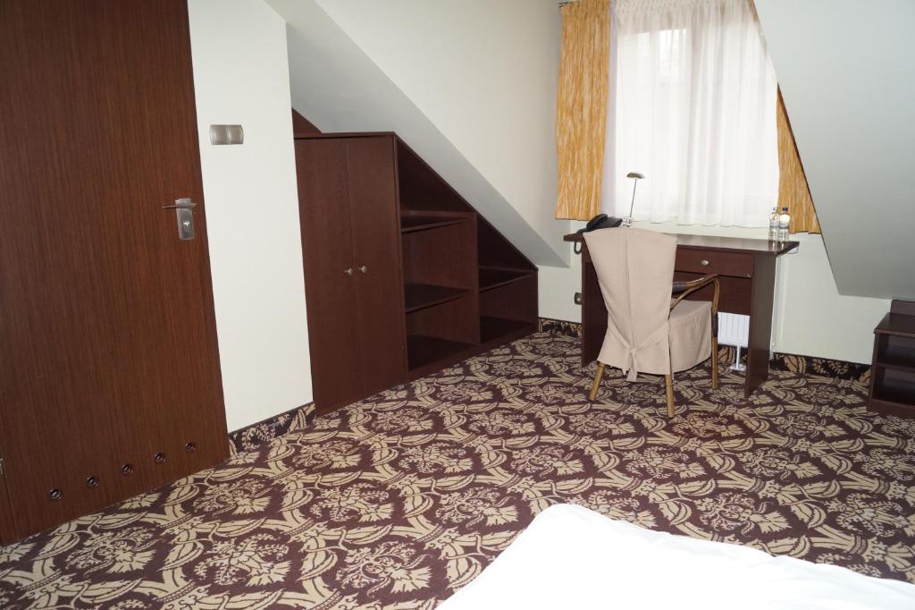 Posteľ alebo postele v izbe v ubytovaní Hotel Słoneczny Brzeg