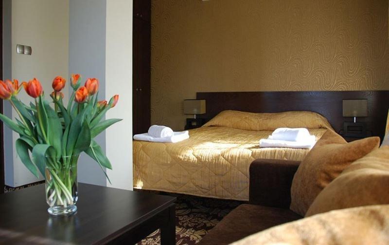 Posteľ alebo postele v izbe v ubytovaní Hotel Słoneczny Brzeg