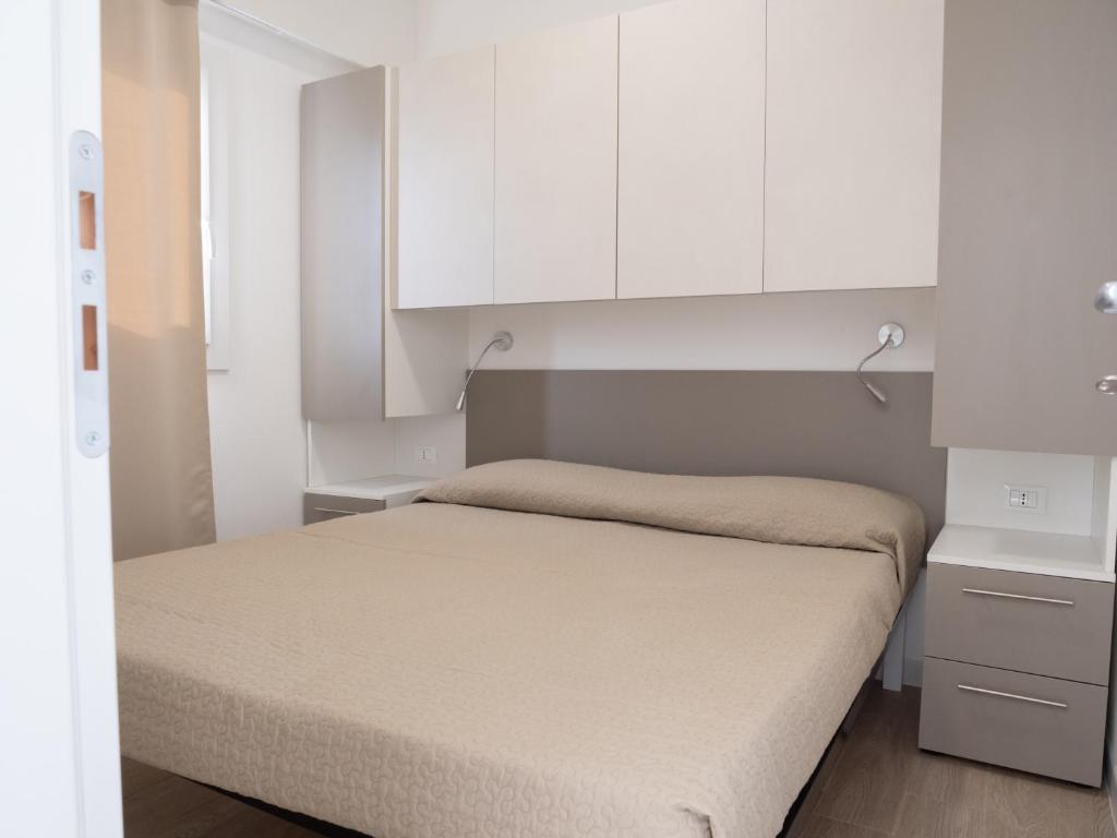 Postel nebo postele na pokoji v ubytování Santo Stefano Village