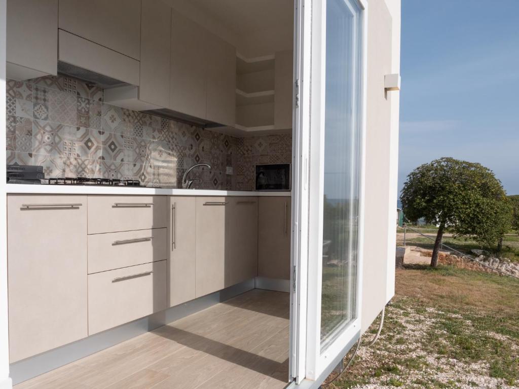 Kuchyň nebo kuchyňský kout v ubytování Santo Stefano Village