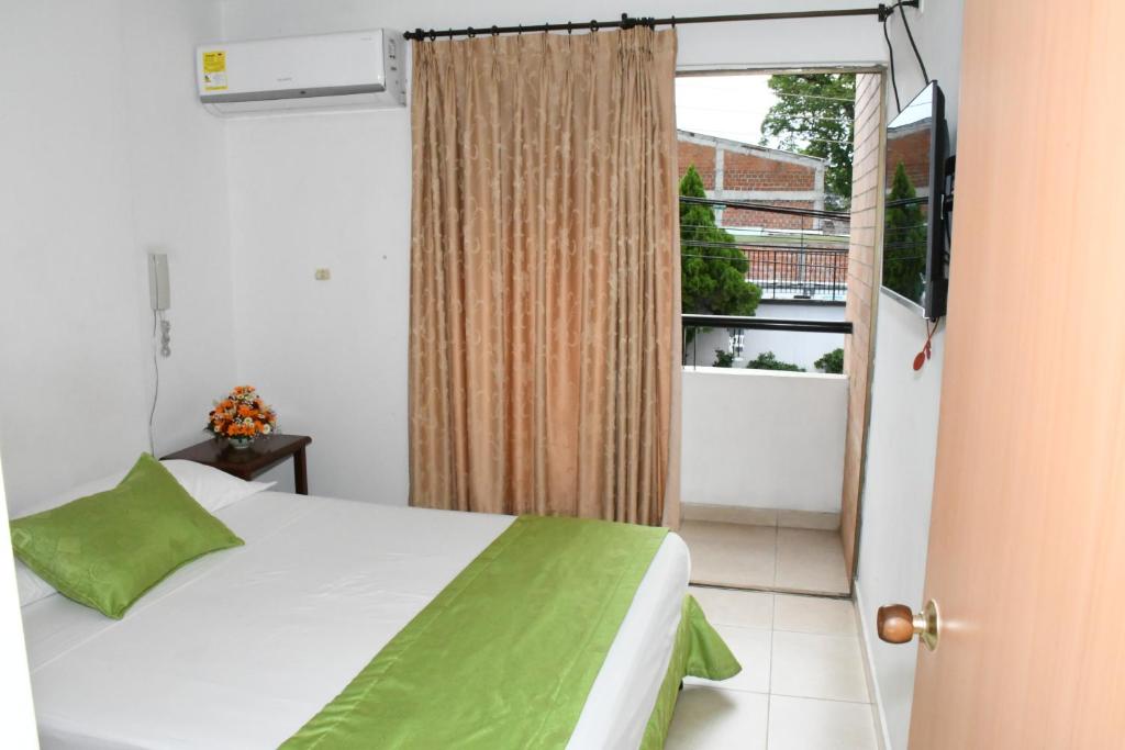 Postel nebo postele na pokoji v ubytování Apartahotel Los Cerezos