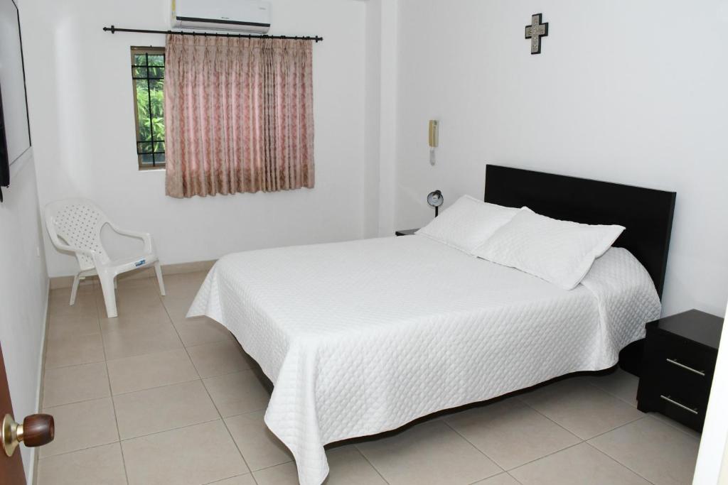 Postel nebo postele na pokoji v ubytování Apartahotel Los Cerezos