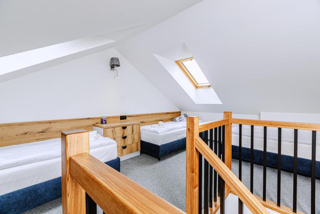 Postel nebo postele na pokoji v ubytování KASHUBIAN Resort