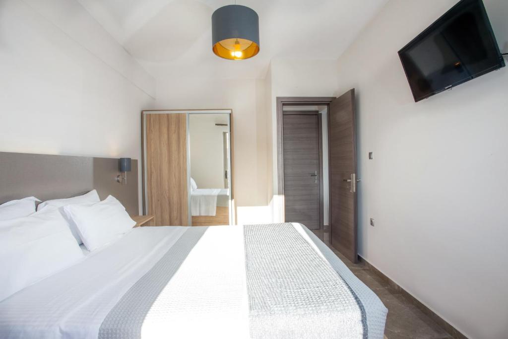 Posteľ alebo postele v izbe v ubytovaní Vardians Villas & Suites