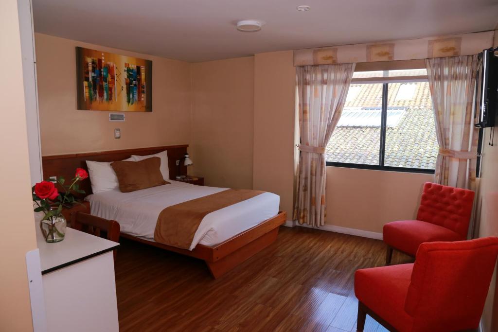 Postel nebo postele na pokoji v ubytování Hotel Carolina Montecarlo