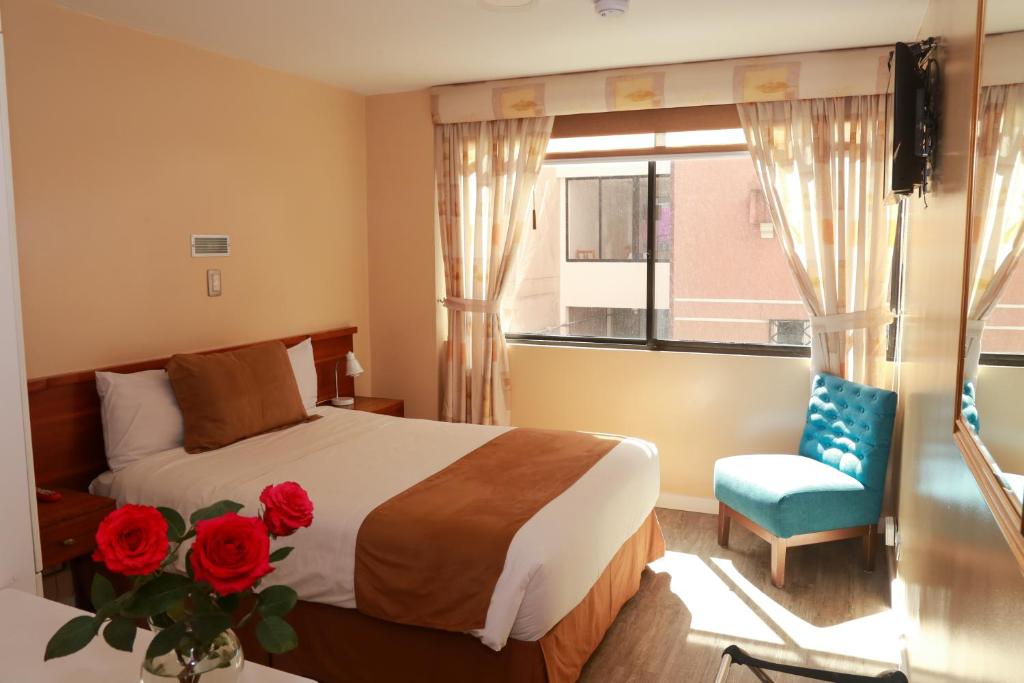 Postel nebo postele na pokoji v ubytování Hotel Carolina Montecarlo