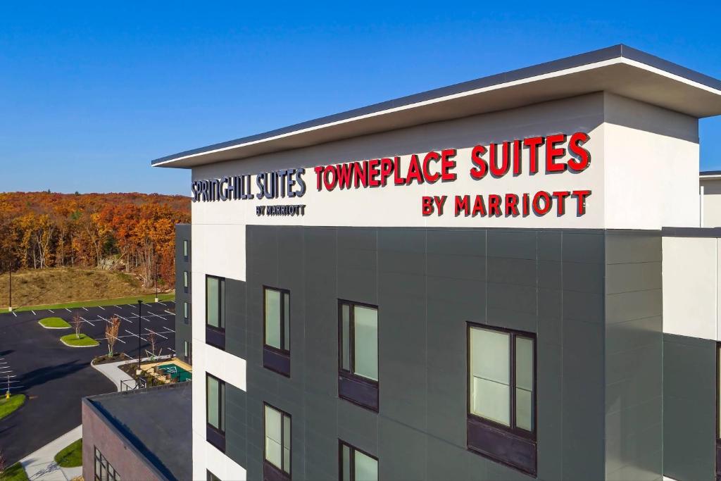 a building with a sign on the top of it at TownePlace Suites By Marriott Wrentham Plainville in Wrentham