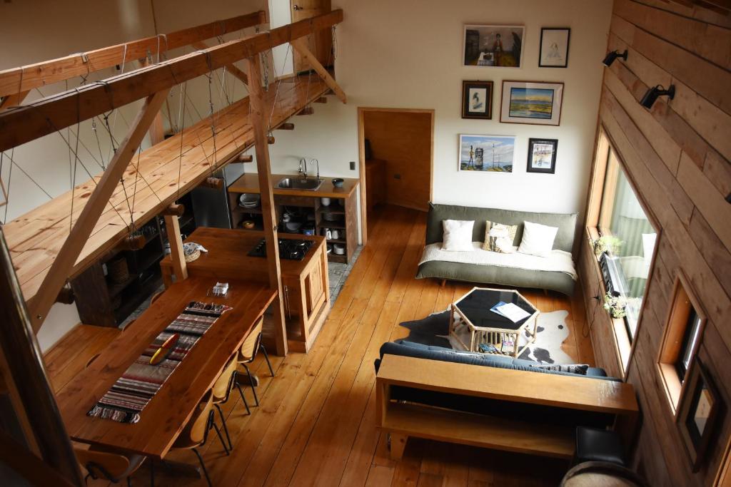 an overhead view of a living room with a staircase at Casa Puente de Chiloé in Castro