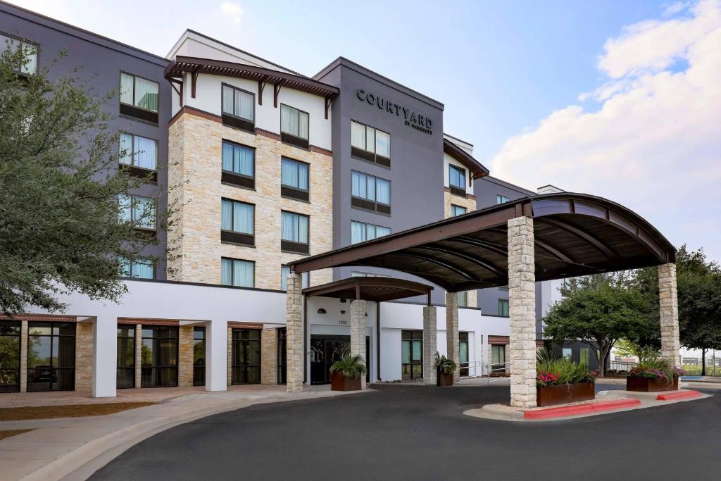 a rendering of the front of a building at Courtyard Austin Airport in Austin