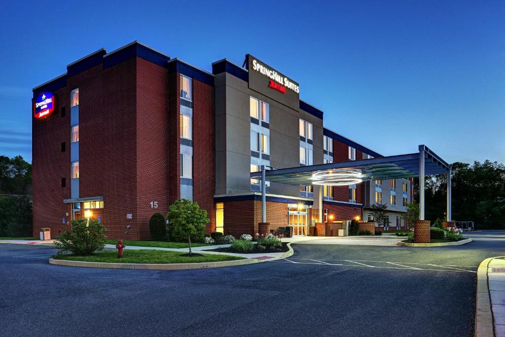 a hotel building with a sign on the side of it at SpringHill Suites Harrisburg Hershey in Harrisburg