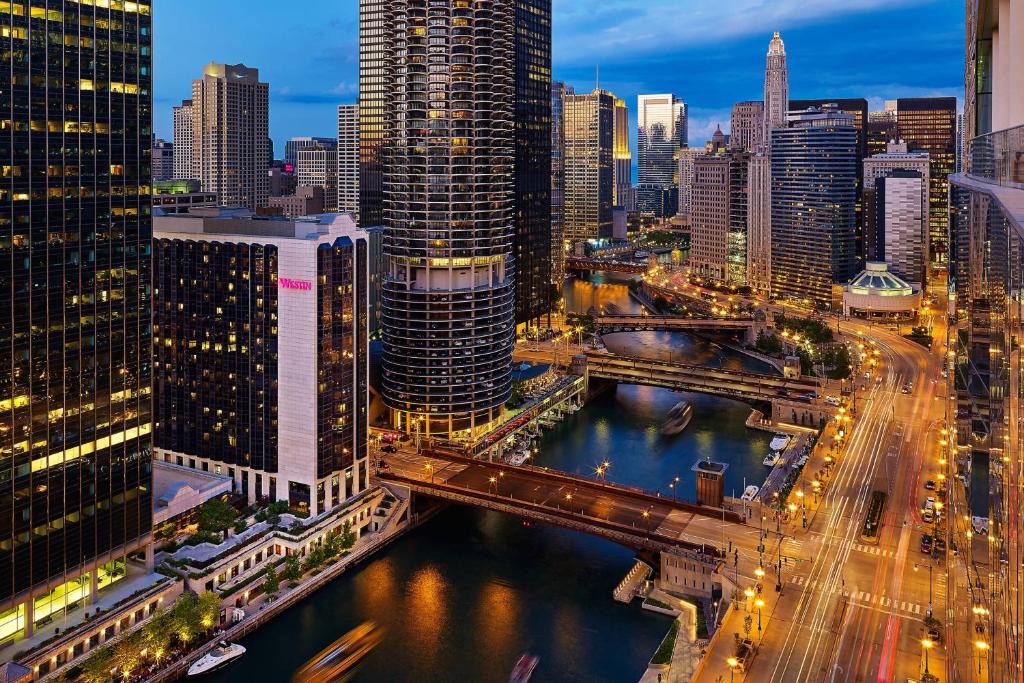 a city skyline with a bridge over a river at The Westin Chicago River North in Chicago