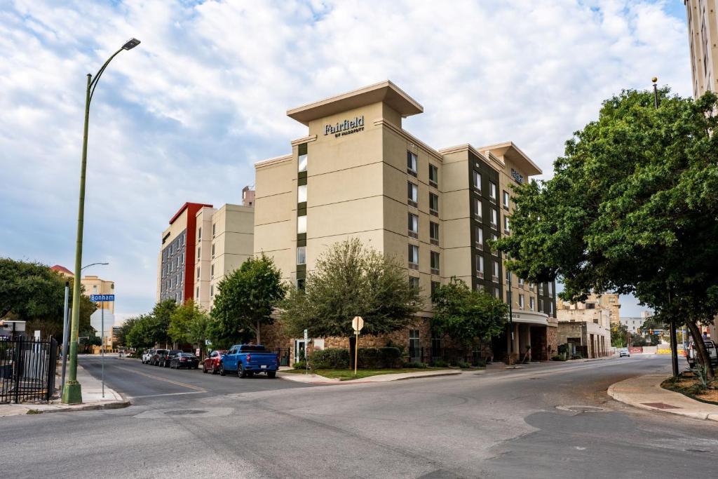 a large building on a city street with a street at Fairfield Inn & Suites by Marriott San Antonio Downtown/Alamo Plaza in San Antonio