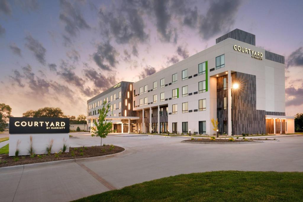 a rendering of a campus building with a sunset at Courtyard Ames in Ames