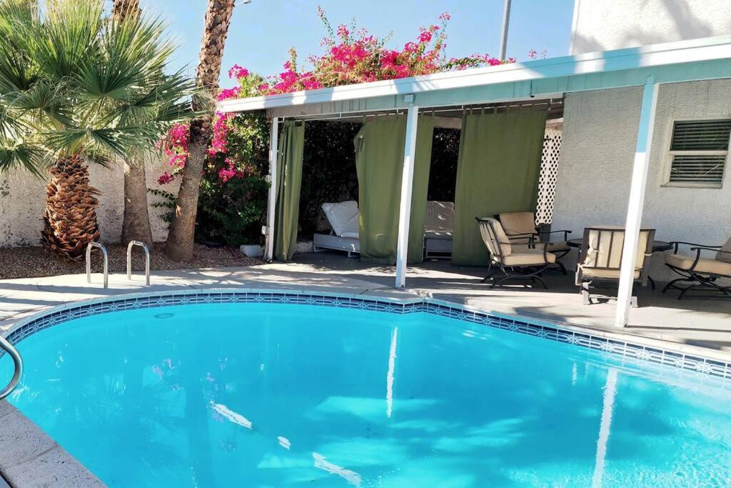 a swimming pool in front of a house at The Vegas Escape - Near the Airport/Strip with Pool in Las Vegas