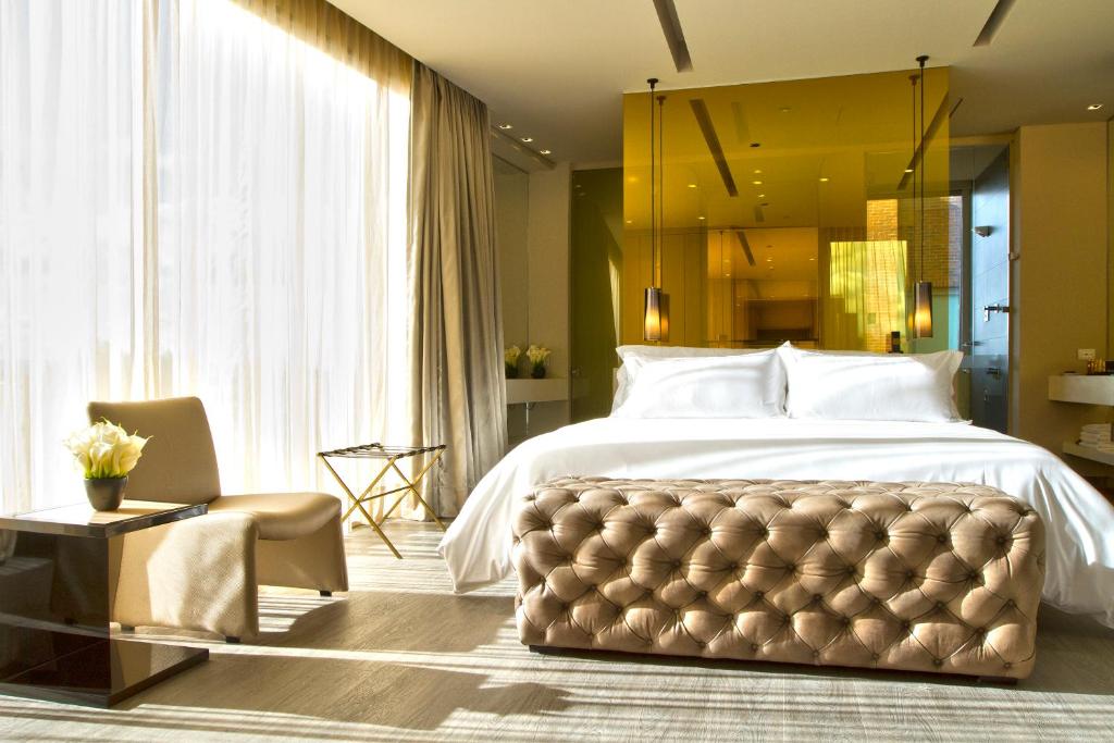 Postel nebo postele na pokoji v ubytování BOG Hotel