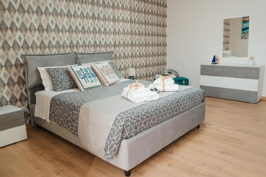 A bed or beds in a room at DOMUS 73 Apulian holidays