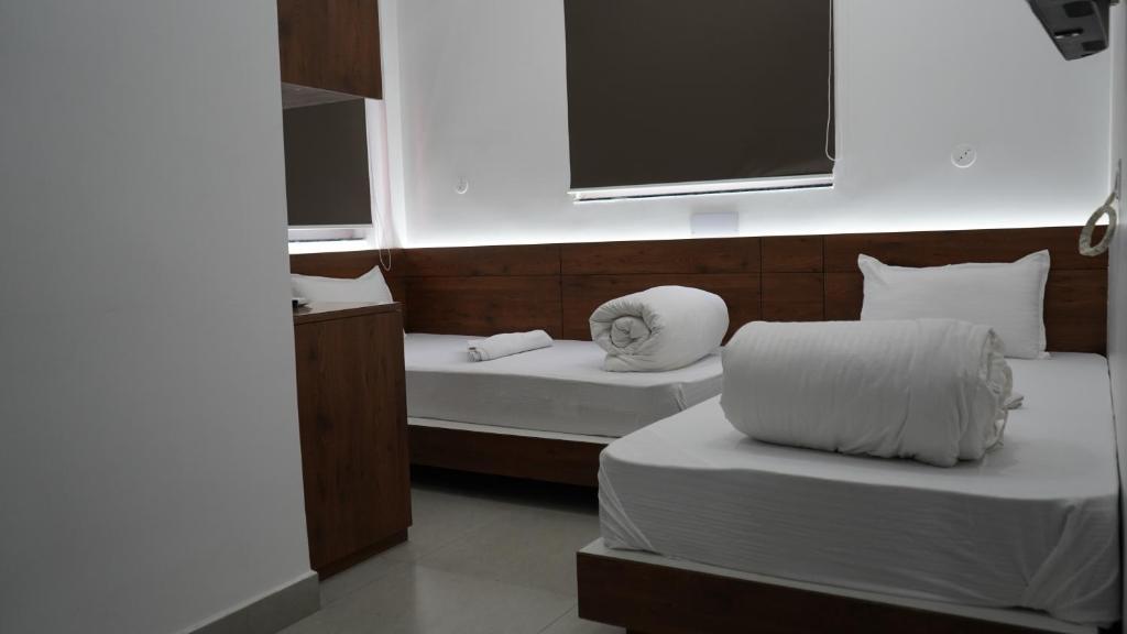 Postel nebo postele na pokoji v ubytování POD N BEYOND SMART HOTEL @BISTUPUR