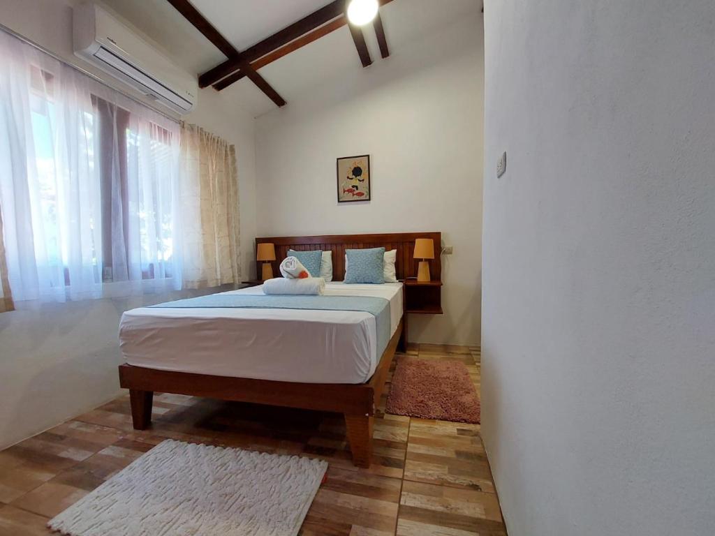 Postel nebo postele na pokoji v ubytování Casa THIREMA Tortuguero