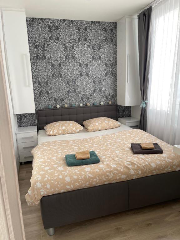 Posteľ alebo postele v izbe v ubytovaní Útulný apartmán v centre Košíc, Juh - s parkovaním