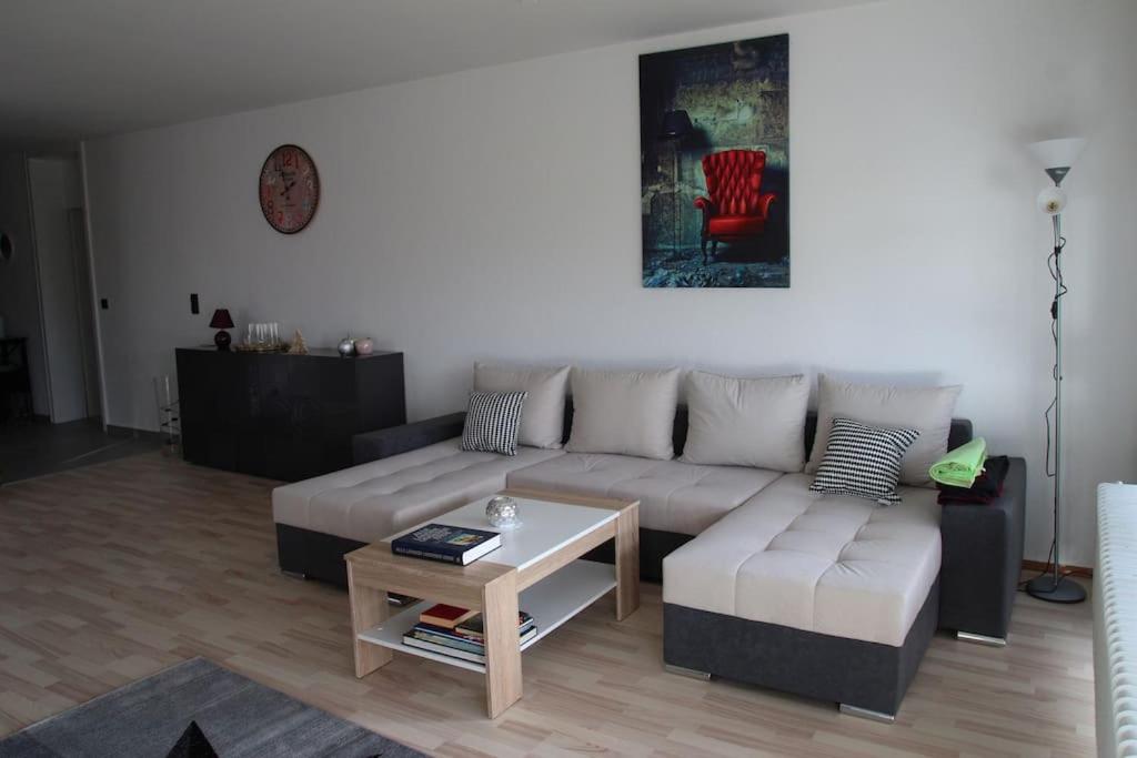 a living room with a couch and a coffee table at Gästewohnung Pakulies in Weinheim
