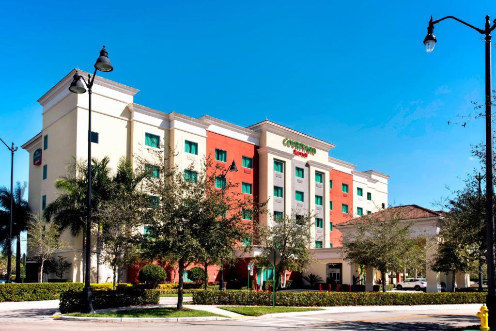 una representación de la parte delantera de un hotel en Courtyard by Marriott Miami Homestead, en Homestead