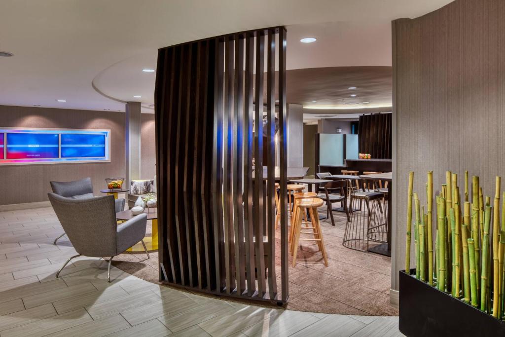 a lobby with a living room and a dining room at SpringHill Suites by Marriott Salt Lake City Downtown in Salt Lake City