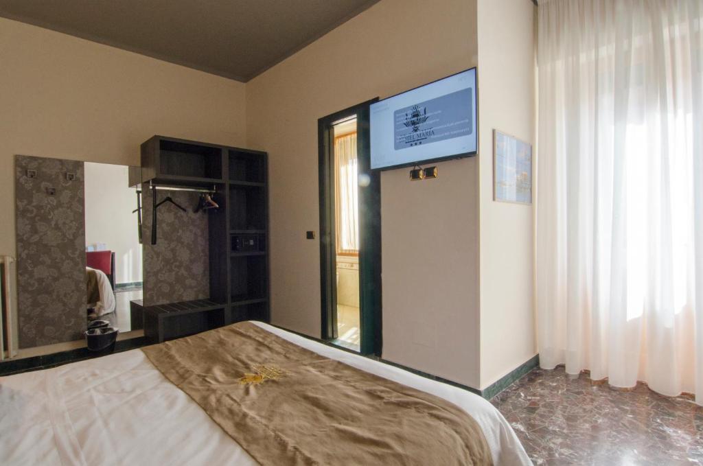 Postel nebo postele na pokoji v ubytování Hotel Maria