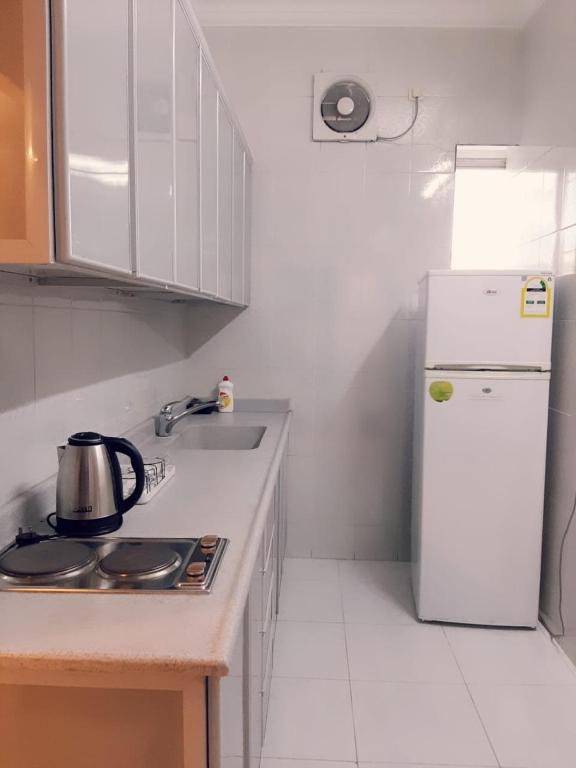 Kuchyň nebo kuchyňský kout v ubytování Ritan Apart-Hotel