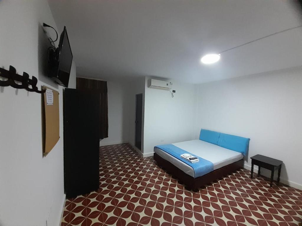 Cama o camas de una habitación en Hotel Tamaiti