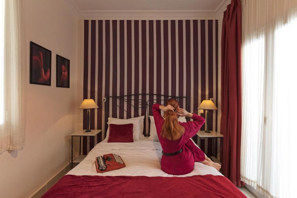 Postel nebo postele na pokoji v ubytování Kimon Hotel Athens