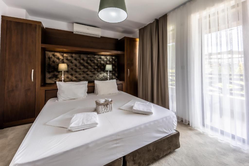 Postel nebo postele na pokoji v ubytování Rocca Resort