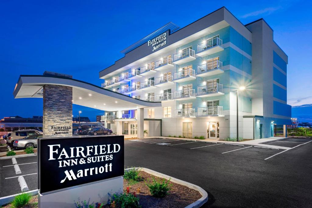 a hotel with a sign in front of a parking lot at Fairfield Inn & Suites by Marriott Ocean City in Ocean City