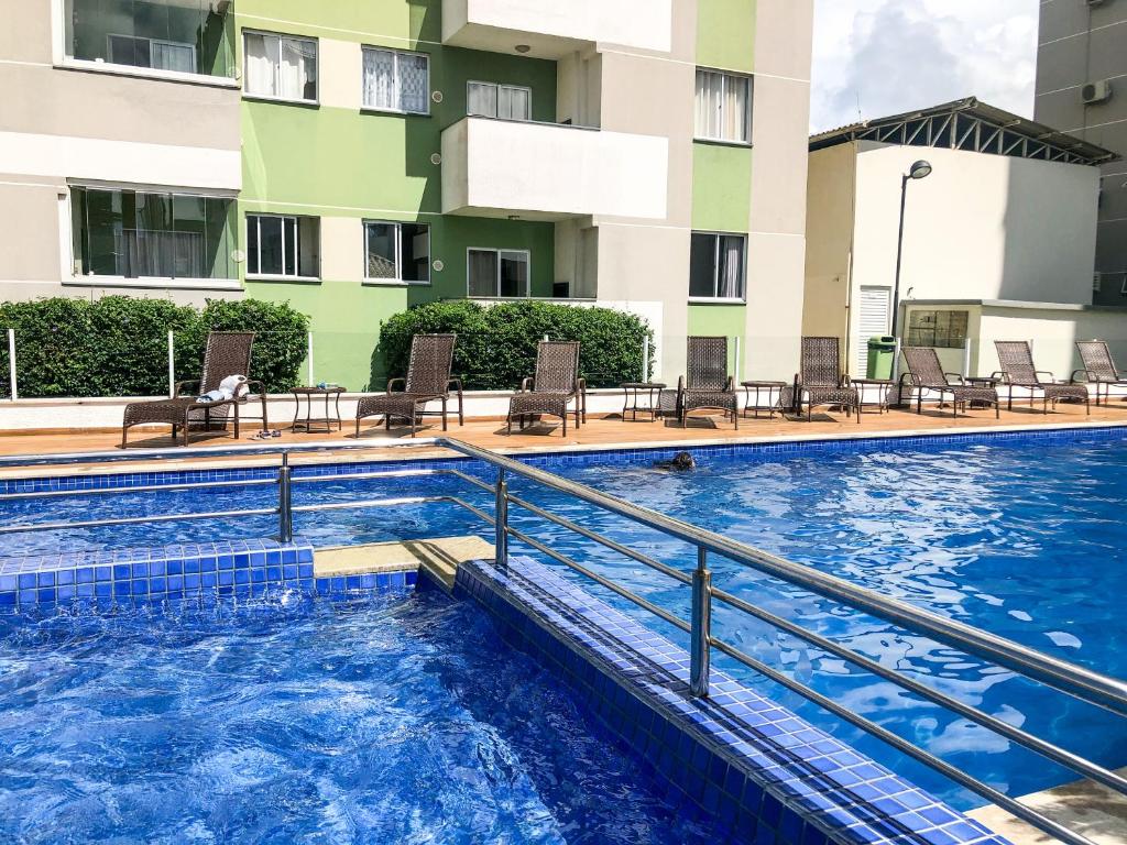 a swimming pool in front of a building at Apt 300 m da praia próximo ao Beto Carrero in Piçarras