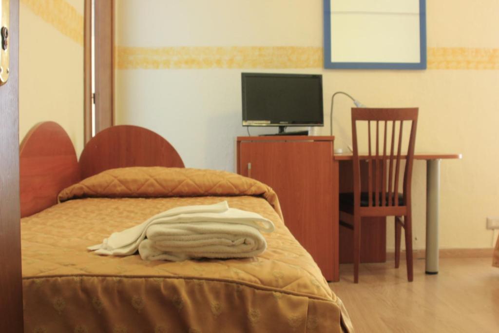 Postel nebo postele na pokoji v ubytování Hotel Bellevue