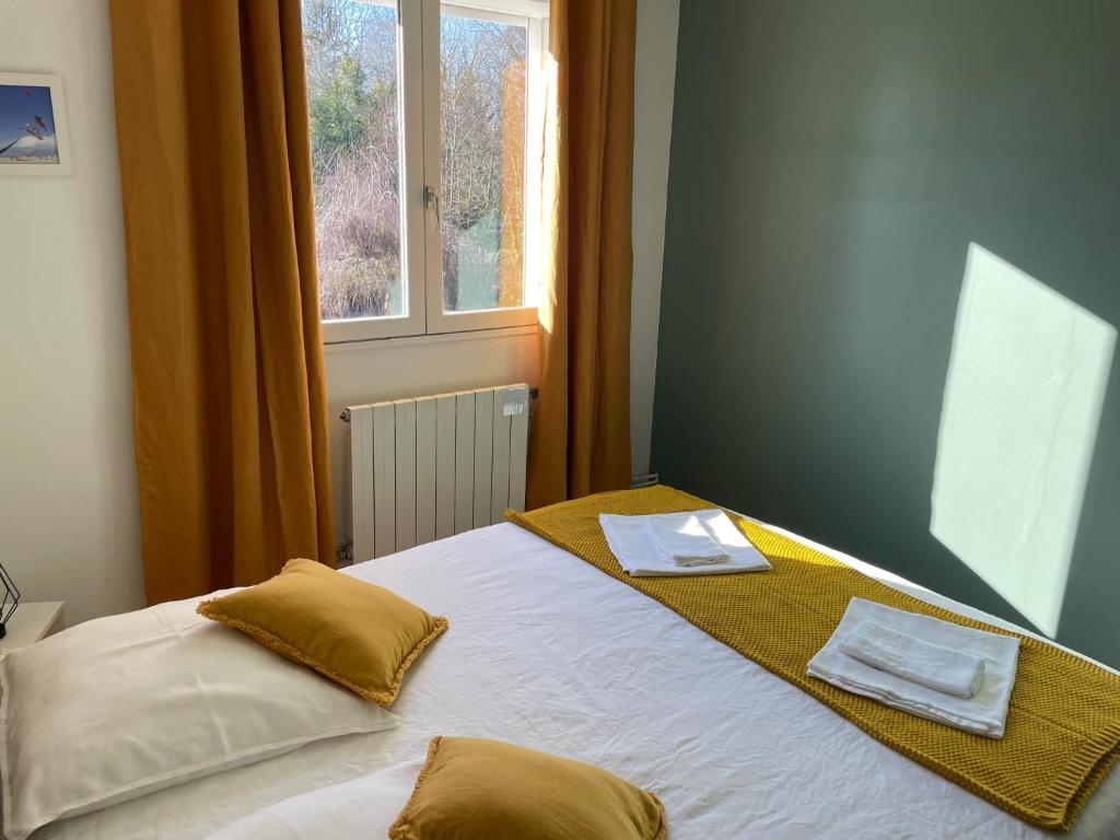 Postel nebo postele na pokoji v ubytování Le Vrai Paradis
