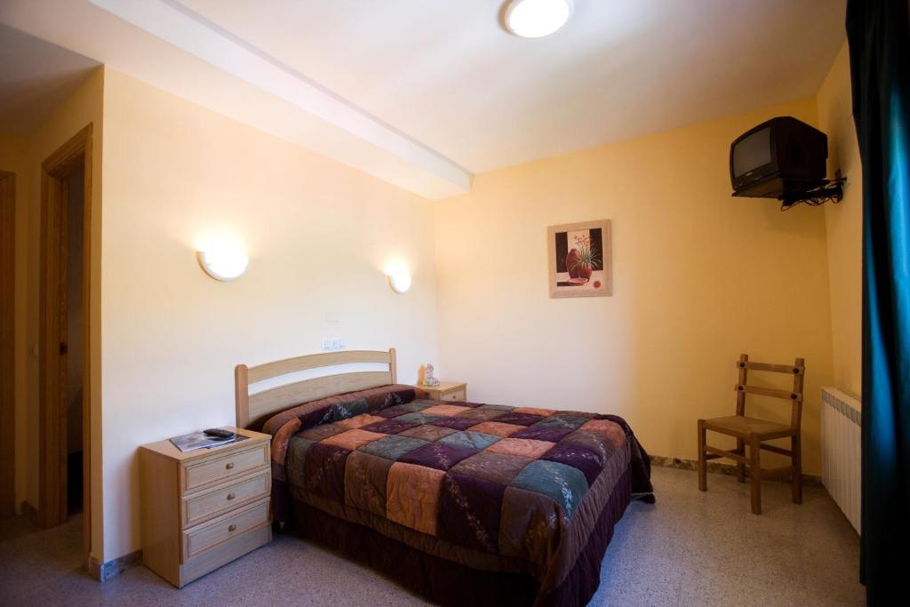 Cama o camas de una habitación en Hostal Las Rumbas