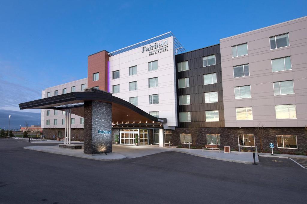 a building with a parking lot in front of it at Fairfield by Marriott Edmonton International Airport in Edmonton