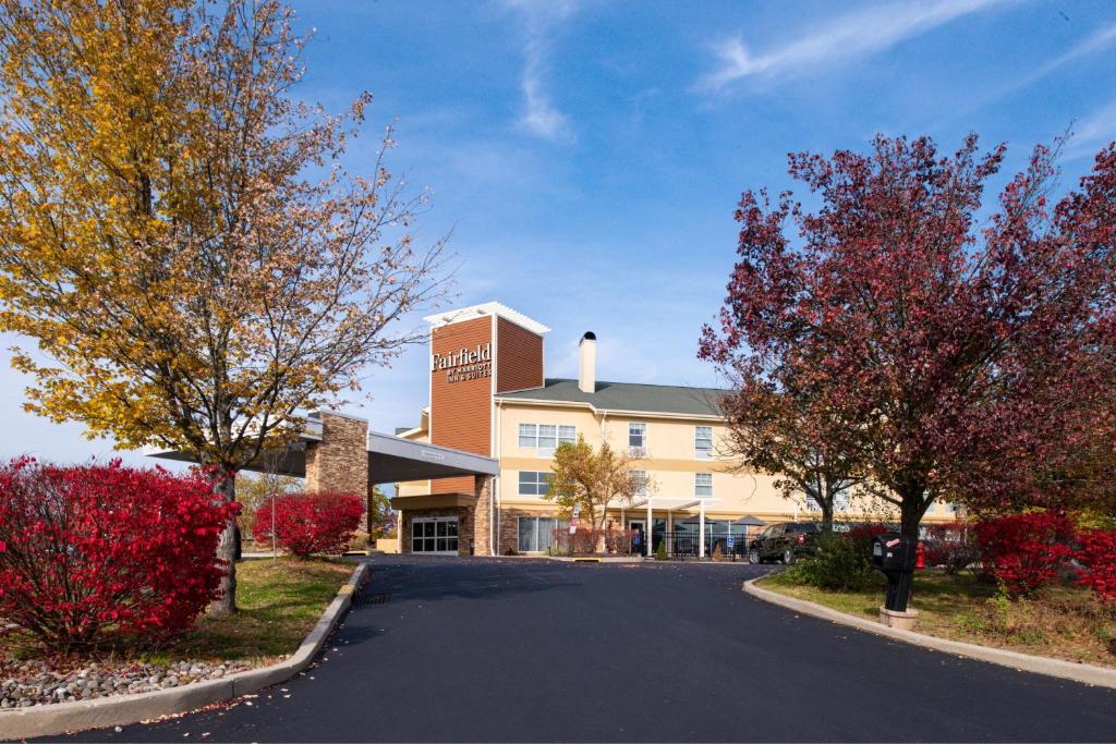 a road in front of a building with trees at Fairfield Inn & Suites Goshen Middletown in Goshen