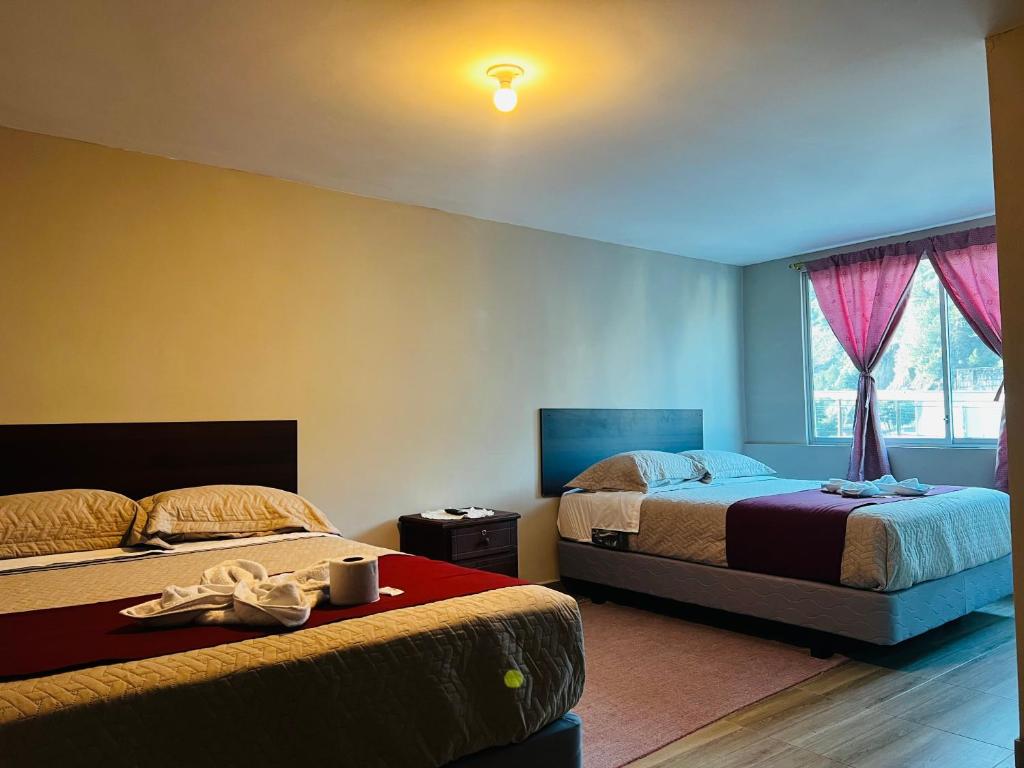 Postel nebo postele na pokoji v ubytování Casa de Joss