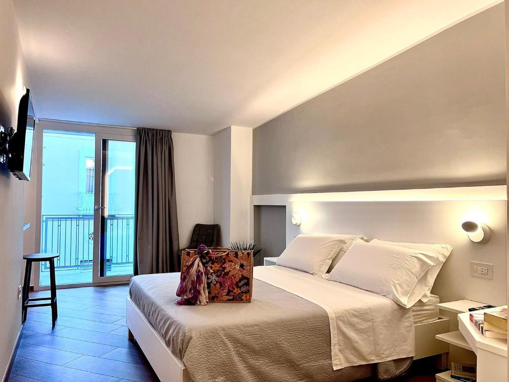 A bed or beds in a room at Tropea Il Tridente Accommodations